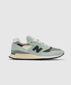 Men's mint green and grey streetwear sneaker with black logo and Abzorb sole on white background