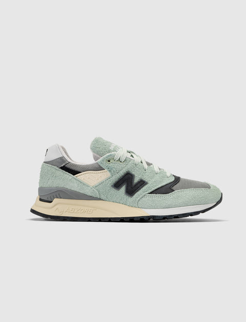 Men's mint green and grey streetwear sneaker with black logo and Abzorb sole on white background
