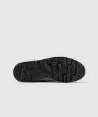 Black New Balance 998 sneaker outsole with textured tread pattern on white background