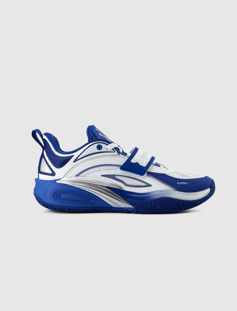 Blue and white men's streetwear sneaker with velcro strap and textured sole on white background