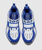 Top view of blue and white athletic sneakers with mesh panels and unique strap design
