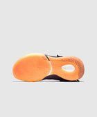 Orange gradient rubber sneaker sole with intricate grip pattern, shown on light grey background