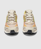 Beige and yellow mesh lace-up sneakers with Adidas logo, front view on white background