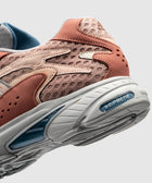 Closeup of pink and tan mesh sneaker with Adiprene sole and blue interior lining