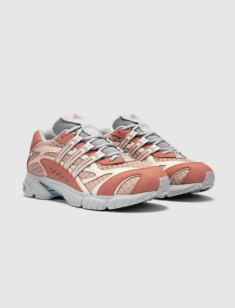 Pair of clay and beige mesh streetwear sneakers with grey accents on a white background