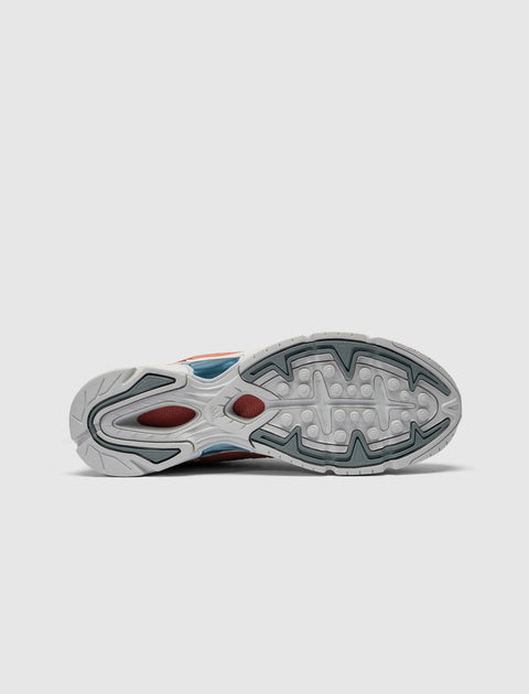 Streetwear sneaker outsole in white, grey, and red with grip pattern on white background
