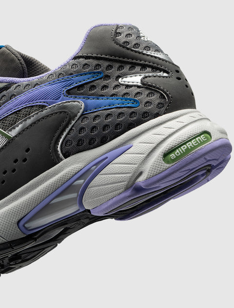 Close-up of grey mesh sneaker with purple and blue accents and adiPRENE sole detail