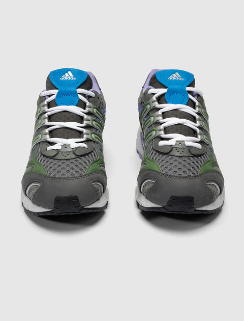 Gray mesh running sneakers with green accents, blue tongue, and white laces, front view