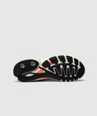 Black and white sneaker outsole with textured grip and visible cushioning details