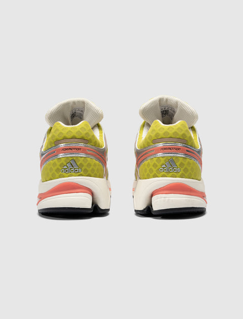 Rear view of yellow and coral Adidas sneakers with mesh upper and Formotion detail