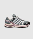 Gray and purple athletic sneaker with mesh and metallic accents, side view on white background