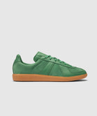 Green suede low-top sneaker with gum sole, adidas branding visible on the side