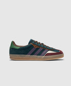 Men’s low-top suede sneaker in navy, green, purple, and burgundy with gum sole