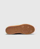 Gum sole sneaker outsole with textured tread and circular grip pattern on white background