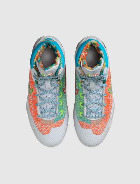 Colorful high-top basketball sneakers with mixed bright patterns and blue laces, top view