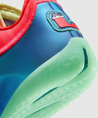 Close-up of a colorful sneaker heel with blue upper and translucent green sole