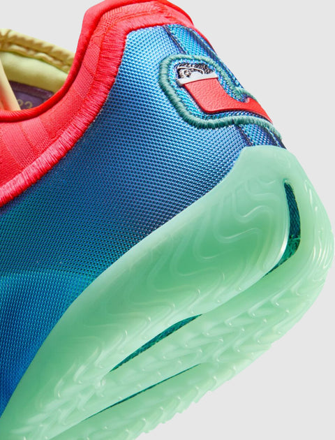 Close-up of a colorful sneaker heel with blue upper and translucent green sole
