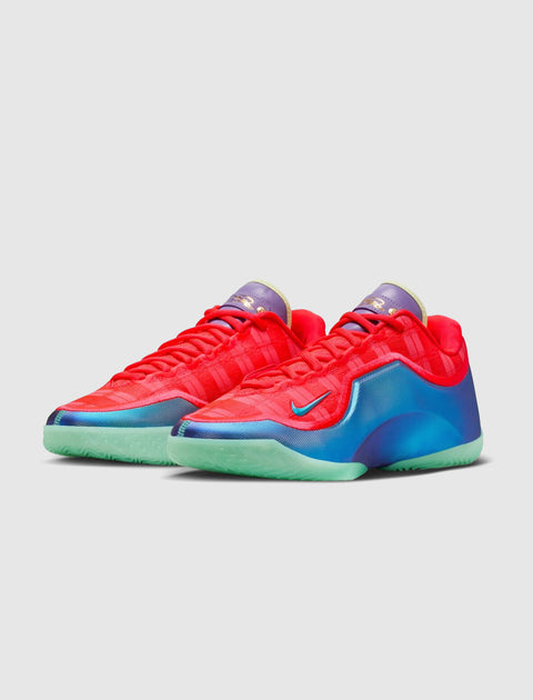 Bright red low-top sneakers with blue and teal accents, mint green soles, and purple tongue.