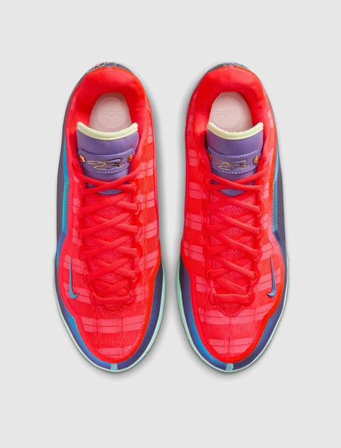Pair of vibrant red and purple men's athletic sneakers with blue accents, top view