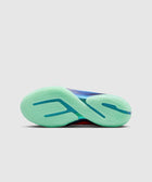Mint green translucent sneaker outsole with wavy traction pattern on a basketball shoe
