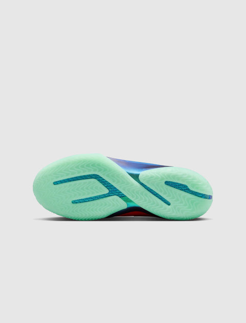 Mint green translucent sneaker outsole with wavy traction pattern on a basketball shoe