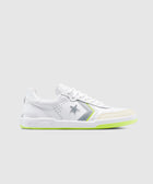 White low-top sneaker with gray star and chevron, neon green sole, side view, on light background