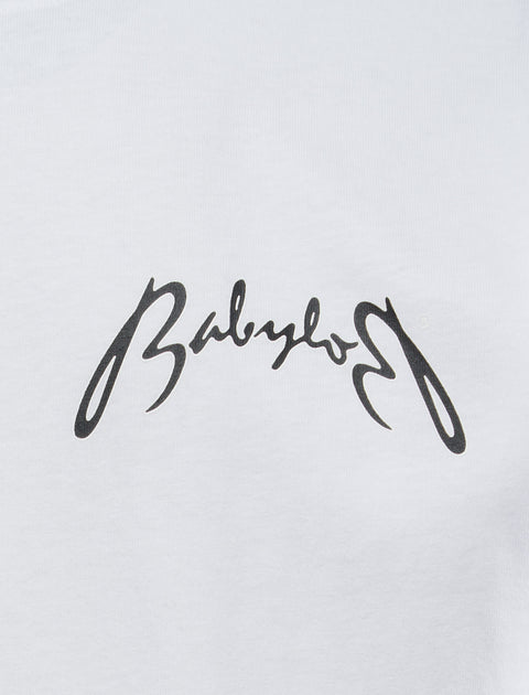 White streetwear t-shirt with bold black cursive script logo on chest