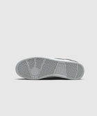 White and black sneaker outsole with textured grip and visible Nike logo