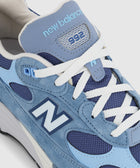 Close-up of New Balance 992 sneaker in blue suede and mesh with white laces