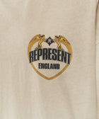 Beige streetwear t-shirt with crest graphic, angel figures, and 'REPRESENT ENGLAND' text