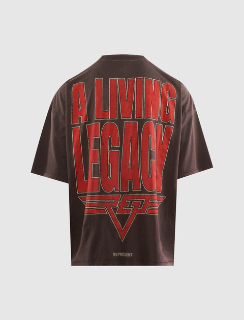 Brown oversized men's streetwear t-shirt with bold red 'A Living Legacy' slogan on the back