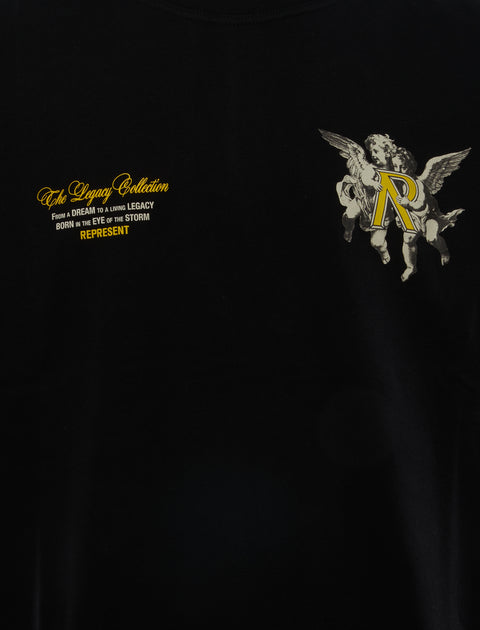 Black streetwear t-shirt with yellow text, angel graphic holding R, The Legacy Collection design