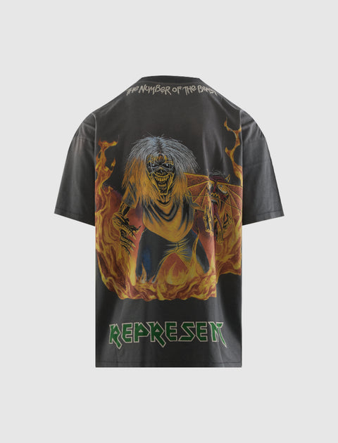 Black graphic streetwear t-shirt with flaming skeleton and bold 'Represent' lettering on back