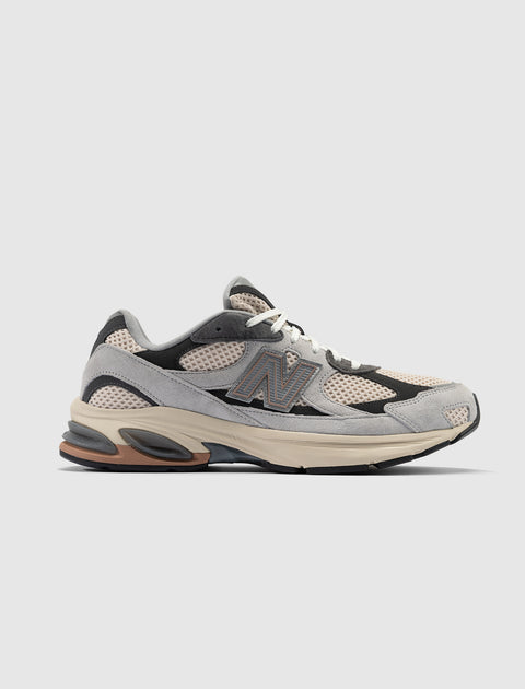 Men's grey and beige mesh suede sneaker with chunky sole, side profile on white background