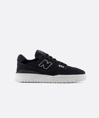 Black low-top sneaker with white sole, side view, minimalist streetwear style