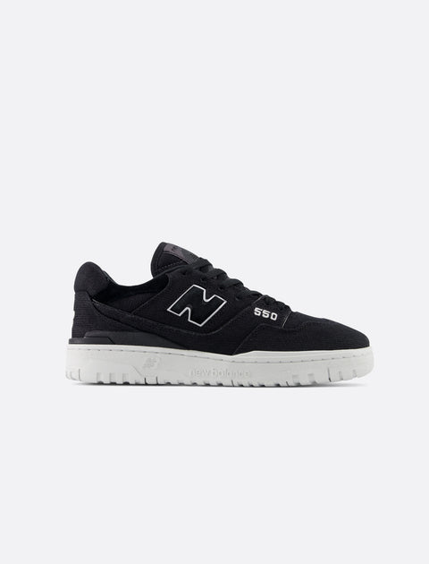 Black low-top sneaker with white sole, side view, minimalist streetwear style