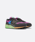 Black, purple, and green men's streetwear sneakers with mesh and suede details