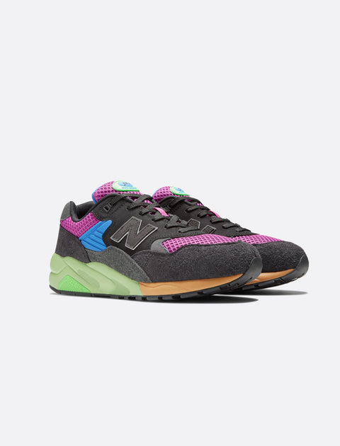 Black, purple, and green men's streetwear sneakers with mesh and suede details