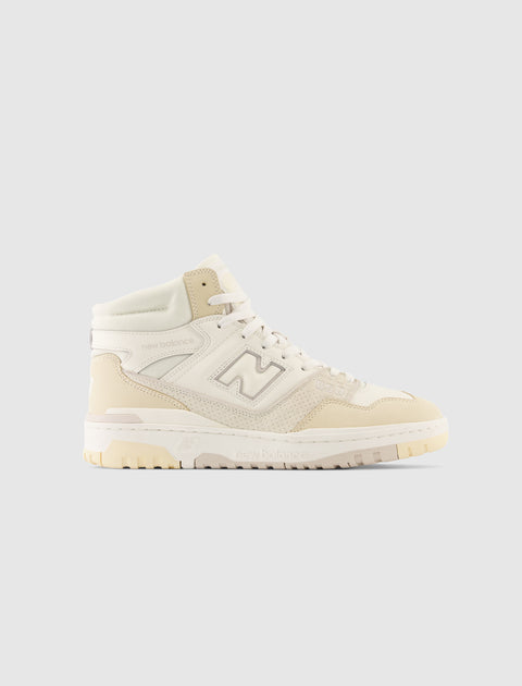 Beige and off-white high-top men's sneaker with lace-up front on light background