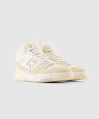 Men's beige high-top sneakers with suede and leather details, side logo, and rubber sole