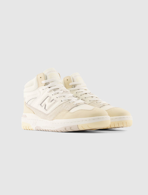 Men's beige high-top sneakers with suede and leather details, side logo, and rubber sole