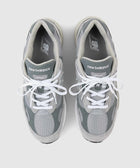 Top view of grey New Balance 992 sneakers with mesh and suede panels, white laces