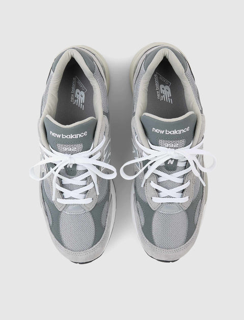 Top view of grey New Balance 992 sneakers with mesh and suede panels, white laces