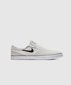 White slip-on sneaker with black swoosh logo and white sole, side profile view
