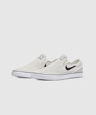 White slip-on skate sneakers with black swoosh logo and white rubber sole on plain background