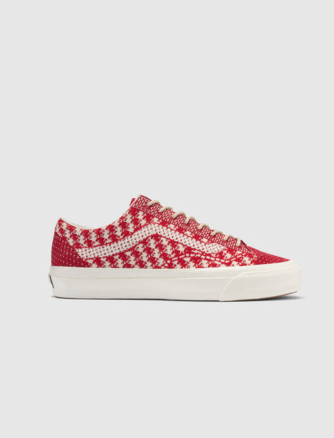 Red and white patterned low-top sneaker with white sole, men's streetwear footwear