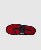 Black and red rubber sneaker sole with textured grip and jumpman logo on light background