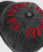 Black denim baseball cap with bold red embroidered text, streetwear accessory