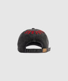 Back view of black washed dad cap with red embroidered text and adjustable strap.