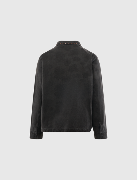 Back view of black denim jacket with studded collar and long sleeves on plain background
